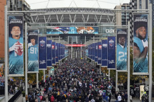 Fans arrive before an NFL game between the Jacksonville Jaguars and the New England Patriots at Wembley Stadium in London. (AP Photo/Steve Luciano, File)