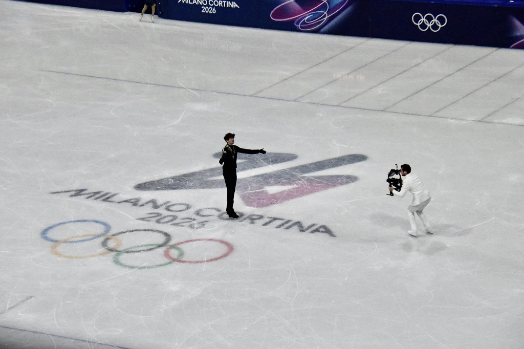 Man in white tux at figure skating