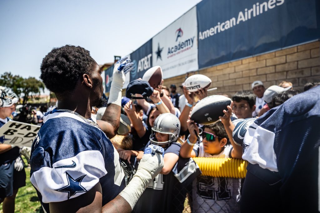 Signing autographs at Cowboys training camp in Oxnard.